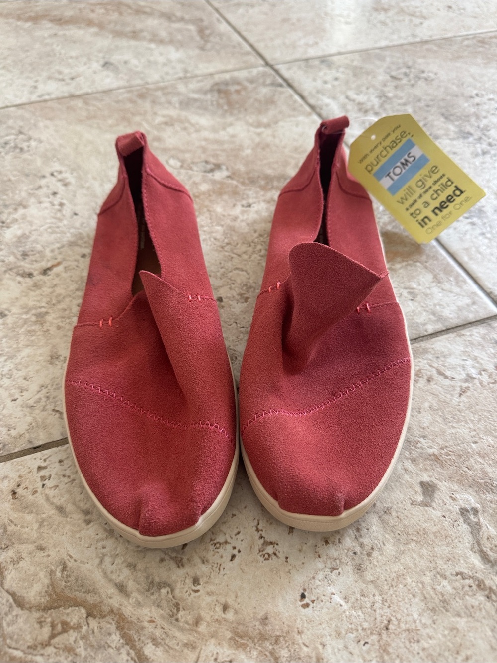 TOMS Women's Slip on sneaker style
in Rust colored Red Suede